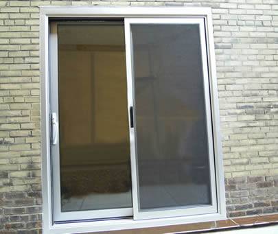 A door covered with the aluminum insect screen and the other door is glass.